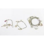 Three silver charm bracelets (3)