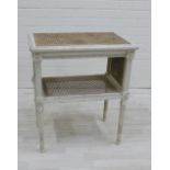 White painted wooden and cane work two tier table, 70 x 62cm