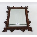 An early 20th century oak framed mirror with rectangular bevelled edge plate, 39 x 24cm