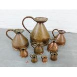 Set of nine graduated copper harvest jugs (9)