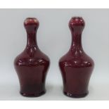 Pair of sang de beouf glazed vases with garlic mouths, 21cm high (2)