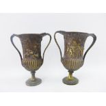 Pair of bronze Classical style urn vases with handles to sides, 21cm high (2)