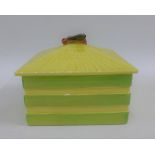 Early 20th century yellow and green glazed pottery box and cover with a Bee finial, 14 x 14cm