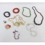 A collection of coloured hardstone jewellery to include beads and a bracelet together with a white