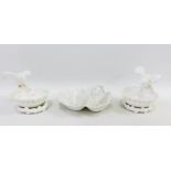 A pair of white glazed bird dishes, with T. Goode retailers mark tot he base and a white glazed leaf