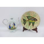 Quimper teapot and a fish patterned slip ware plate (2)