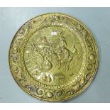 Large circular brass wall charger with Tavern Drinking figures, 64cm diameter