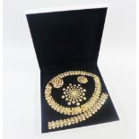 Swarovski boxed set of gilt metal and crystal jewellery to include a brooch, earrings, necklace