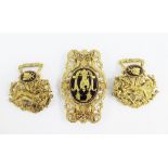 Three piece gilt metal buckle the central oval panel with an Eagle pattern and the side panels