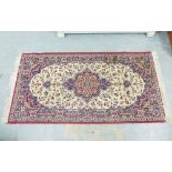 Modern rug with central flowerhead medallion and a allover foliate pattern, 180 x 92cm