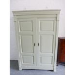 Modern two door wardrobe, the interior shelved and with hanging space, 206 x 142cm