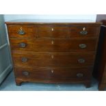 19th century mahogany bow front chest with three short drawers over three long drawers, on bracket