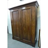 Mahogany wardrobe with outswept pediment over a pair of panelled doors, on a plinth base, 183 x