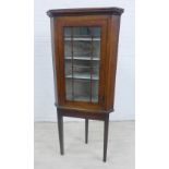 An oak corner cabinet on stand, 180 x 76cm