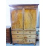 19th century mahogany linen press, with outswept pediment top over a pair of panelled doors, opening