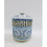 Chinese blue and white candle holder with a detachable pierced cover, decorated with scrolling foli