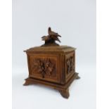 Black Forest carved wooden cigar box, the lid with birds, 23 x 26cm