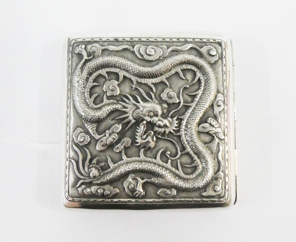 Chinese white metal cigarette case, chased with a dragon pattern, 9 x 9cm