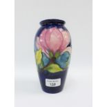 Moorcroft baluster vase, the cobalt blue ground tube line decorated with flowers, with printed