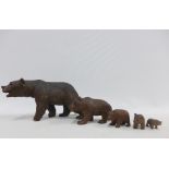 Collection of five Black Forest carved wooden bears, largest 17cm long and the smallest 3cm long (5)