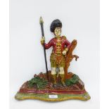 Painted cast metal Scotsman doorstop, 40cm high