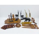 Mixed lot to include a quantity of carved African wooden figures to include a Rhino, etc (a lot)