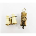 Late 19th / early 20th century gilt metal and ivory charms to include Napoleon and binoculars (2)