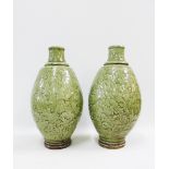 Pair of Longquan celadon glazed vases of ovoid baluster form, moulded and incised with peony and