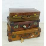Three early 20th century leather travel suitcases, one with canvas cover, largest 70 x 42cm (3)