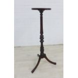 Mahogany torchere with circular top and baluster column on tripod legs, 100 x 28cm