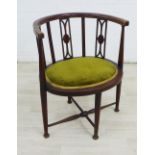 Mahogany inlaid corner chair with stylised vertical splats and green upholstered seat, on tapering
