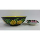 Wemyss black glazed basin with yellow rose pattern, restored, together with Wemyss cabbage rose