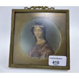 Oval framed circular printed portrait miniature of a girl, contained within a glazed brass frame, 13