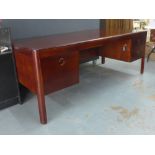 Gordon Russell 'Harvey' desk, the rectangular top with rounded edge, over one deep drawer and two