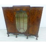 Mahogany and burr wood cabinet with central glazed panel flanked by cupboard doors, on cabriole