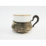Limoges white glazed porcelain cup in a continental silver cup holder, 6cm high