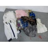 Case containing a quantity of vintage clothing to include a wedding dress and bridesmaid dress,