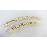 Two early 20th century carved ivory tusks, longest 56cm (2)