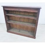 Early 20th century stained pine open bookcase with panelled back, 105 x 121cm