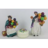 Two Royal Doulton figures 'Old Balloon Seller' HN1315 & 'Biddy Penny Farthing' HN1843 together