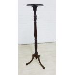 Mahogany torchere, on baluster turned column and with tripod legs, 123cm