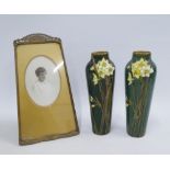 Art Nouveau brass photograph frame, 29cm high, together with a pair of Doulton Burslem Daffodil