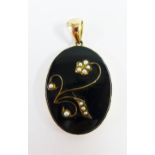 Mourning pendant with black oval plaque with seed pearls, the reverse with locket panel, with a