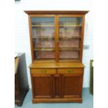 19th century mahogany bookcase cabinet, the cornice top over a pair of glazed doors with two