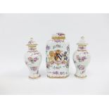 A group of Samson Armorial porcelains to include a tea caddy and cover and a pair of covered