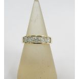 9ct gold ring, chanel set with five diamonds, stamped 1.00ct and with full set of hallmarks, UK ring