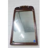 Mahogany and parcel gilt wall mirror, 72 x 39cm