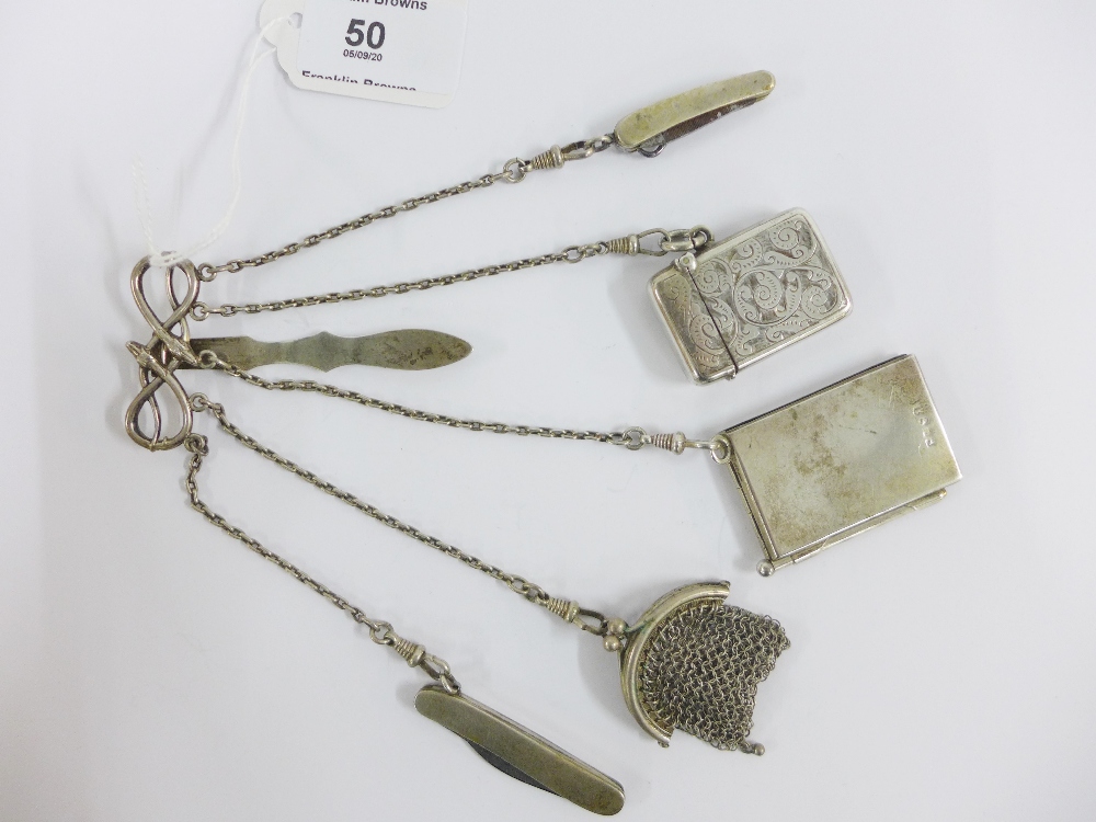 Continental silver chatelaine hung with a Birmingham silver vesta case, two white metal fruit /