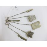 Continental silver chatelaine hung with a Birmingham silver vesta case, two white metal fruit /