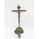 Early continental silver Corpus Christi Cavalry Crucifix, with Baroque base surmounted by skull